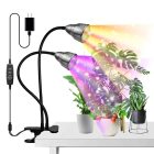 Led grow lights with flexible arms shining on various houseplants on a table, depicting enhanced plant growth effects.
