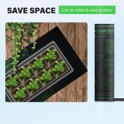 A rollable seed starter mat with young plants on a wooden surface next to its packaging with the text "save space.